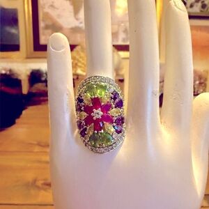 Green and Purple Gemstone Ring with Ornate Design